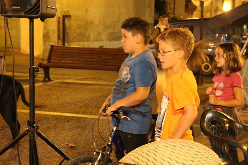 boys watch the people dance