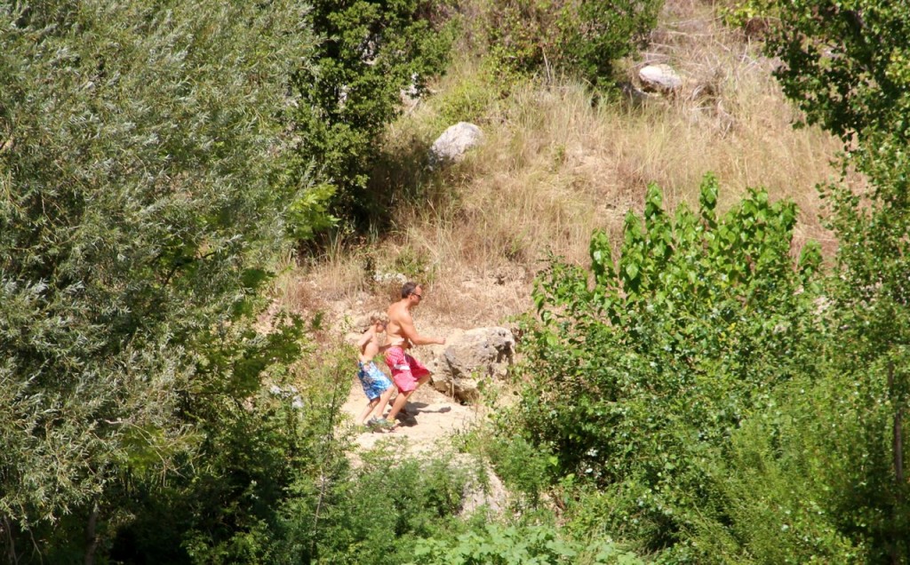 Alfonz and Daniel make their way around the river and dammed pool