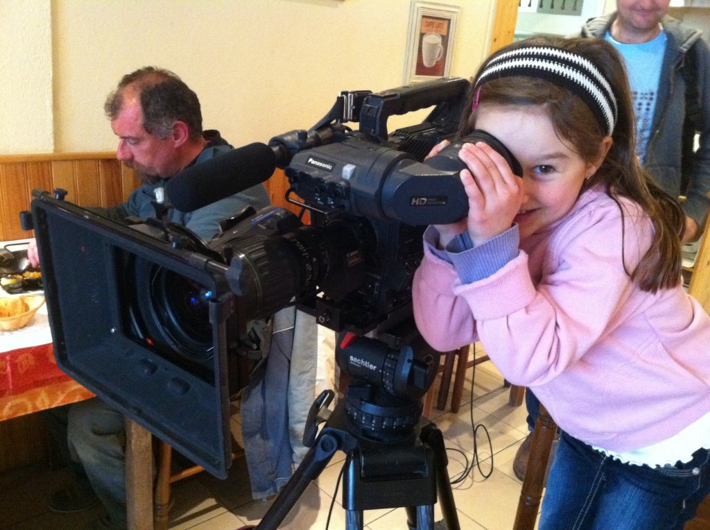 During filming Angelina takes a peek through the lens